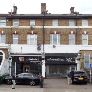 a picture of an unkept terrace of townhouses